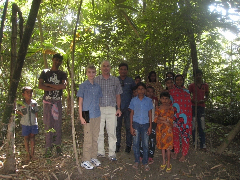 Kevin, Tony, and Kabir and neighborhood children