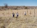 #7: The Confluence is about 150 m behind the people in the photograph, across the border