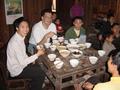 #9: Left to right: schoolteacher, Tony, schoolteacher's "father", plus various other extended family members, preparing to tuck into lunch