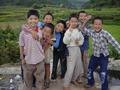 #9: Children on small bridge over stream near Niankeng Village, with confluence point in distance behind them