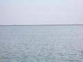 #4: Looking south from the confluence point across the Khawr al-Zubayr riverway, you can see Kuwayt mainland and the shore of Jazīrat Warba, one of the Būbiyān Islands.