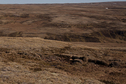 #5: 65Nx21W Overview from 1 km west of CP looking east. CP is on smooth surface 100 m beyond the little triangular hill above image center.