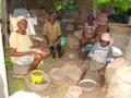 #7: Villagers cracking palm kernels