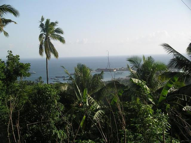 A view of Recodo located along the Caldera Bay as seen from the closest point I got to the Confluence. Note: Outline of Basilan Island over the horizon on the left side of the photo.