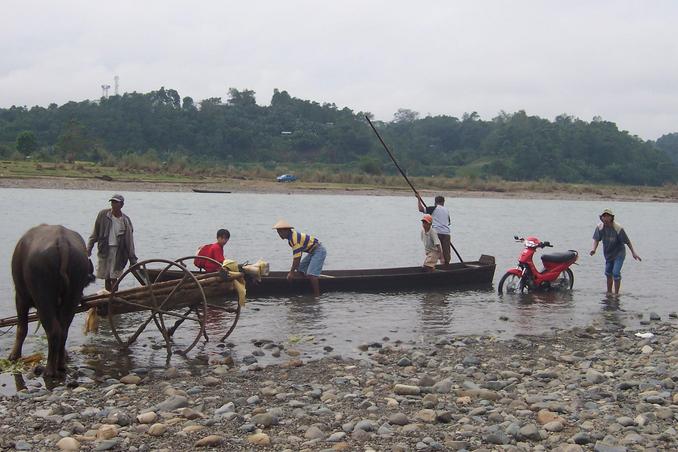 Banca used to cross the river, see my blue Pickup parked on the other side