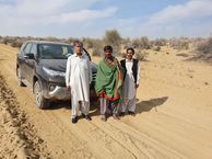 #8: Our drivers with a local passer by on the track