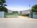 #2: View through the gate. CP is near the piece of machinery in the background, visible under the roof.