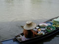 #6: Elderly Thai woman selling produce from her boat along one of the many rivers near the confluence. Fresh fish, meat, and vegetables are abundant in the area.