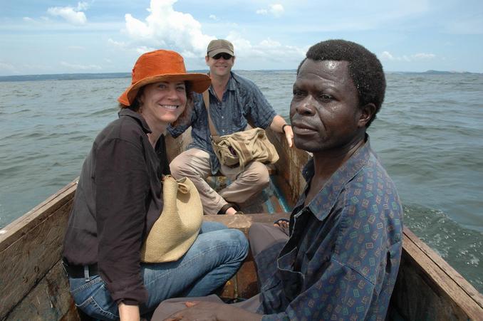 Front of the boat at confluence point - Henry the guide, Linda, and Peter