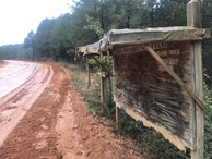 #8: Roadside memorial and muddy road en route to the confluence point. 