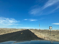 #8: Looking west along NM 120, 6 km northwest of the confluence (photo taken while stationary!)