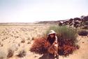 #3: Anita in front of flowers (vehicle in background), looking west